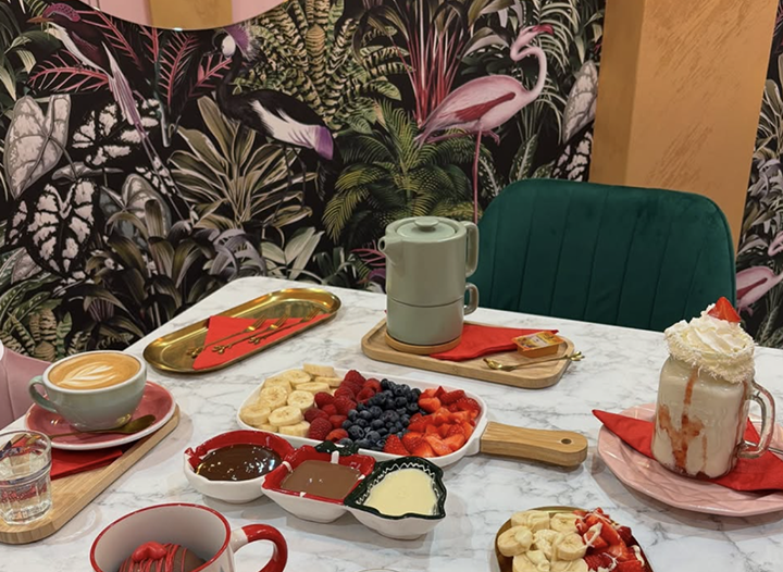 Choco Boss table setting with fruits, chocolate and drinks