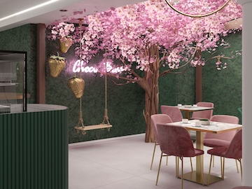Choco Boss store with green accent wall and branded seating area